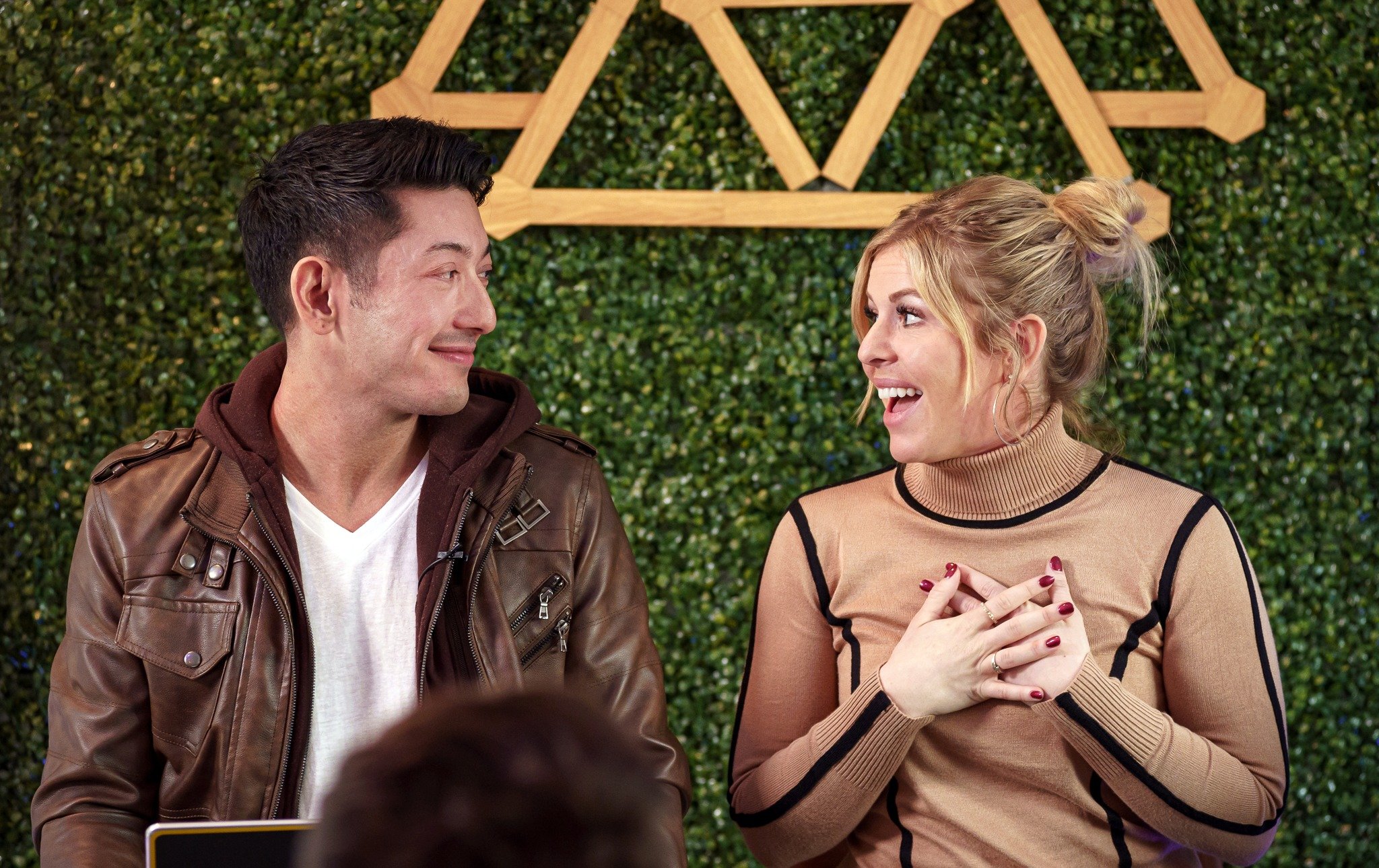 Alex Moscow and Jennifer Hudye Moscow share a moment during a business workshop, Austin TX